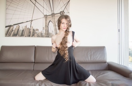 Arousing young model sheds black dress to pose hot body naked in high heels