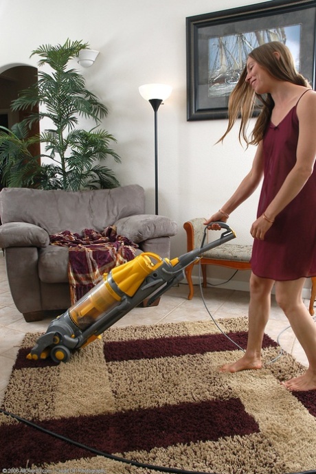 Naughty MILF Maddy exposes her amazing hairy pussy while doing housework